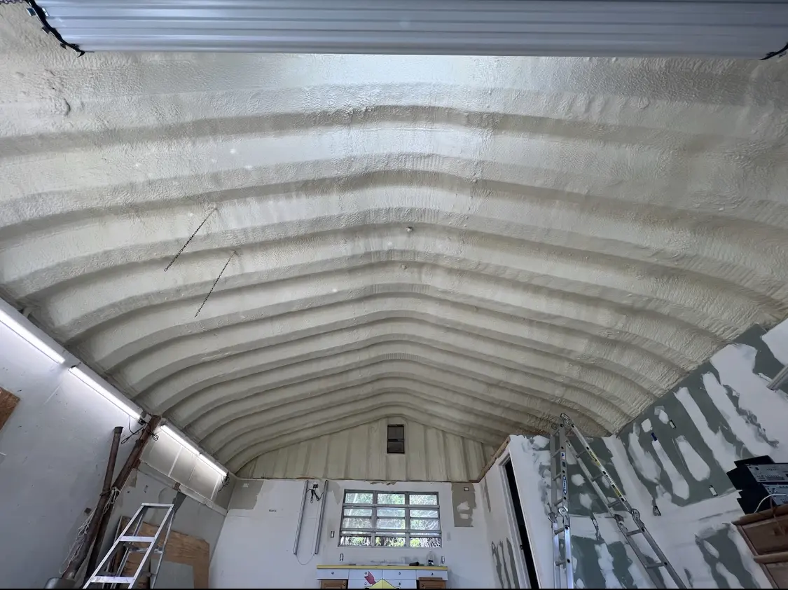 Spray polyurethane foam applied to the underside of a metal roof deck in Hawthorn Woods